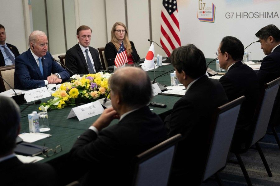 US national security adviser Jake Sullivan (back centre), Japan's Prime Minister Fumio Kishida (second from left) and others listen to US President Joe Biden during a bilateral meeting in Hiroshima on 18 May 2023, ahead of the G7 Leaders' Summit. (Brendan Smialowski/AFP)