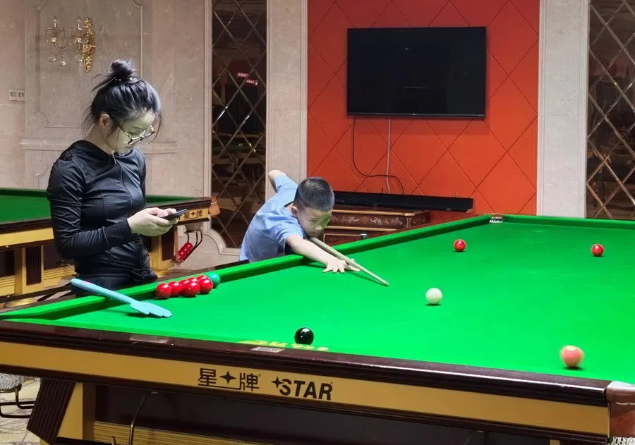 Yao Dongyu started professional snooker training three months ago. His mother always accompanies him to his trainings.