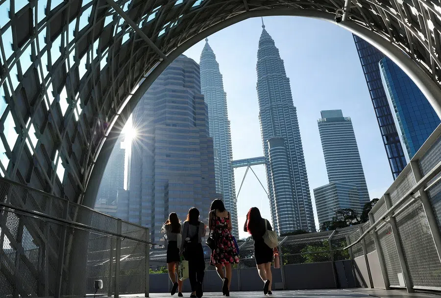 People at Kuala Lumpur city centre, Malaysia, on 16 October 2024. (Hasnoor Hussain/Reuters)