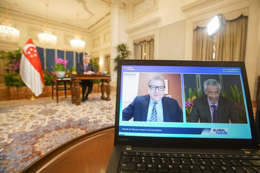 PM Lee Hsien Loong was speaking virtually at the US Chamber of Commerce's inaugural Global Forum on Economic Recovery, and also in a virtual fireside chat (left) with US Chamber of Commerce executive vice-president Myron Brilliant. (Ministry of Communications & Information)