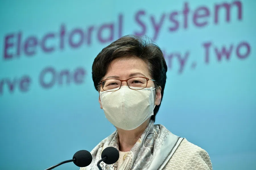 Hong Kong Chief Executive Carrie Lam speaks to the press in Hong Kong on 11 March 2021, after electoral changes for the city were voted in by China's National People's Congress in Beijing. (Anthony Wallace/AFP)