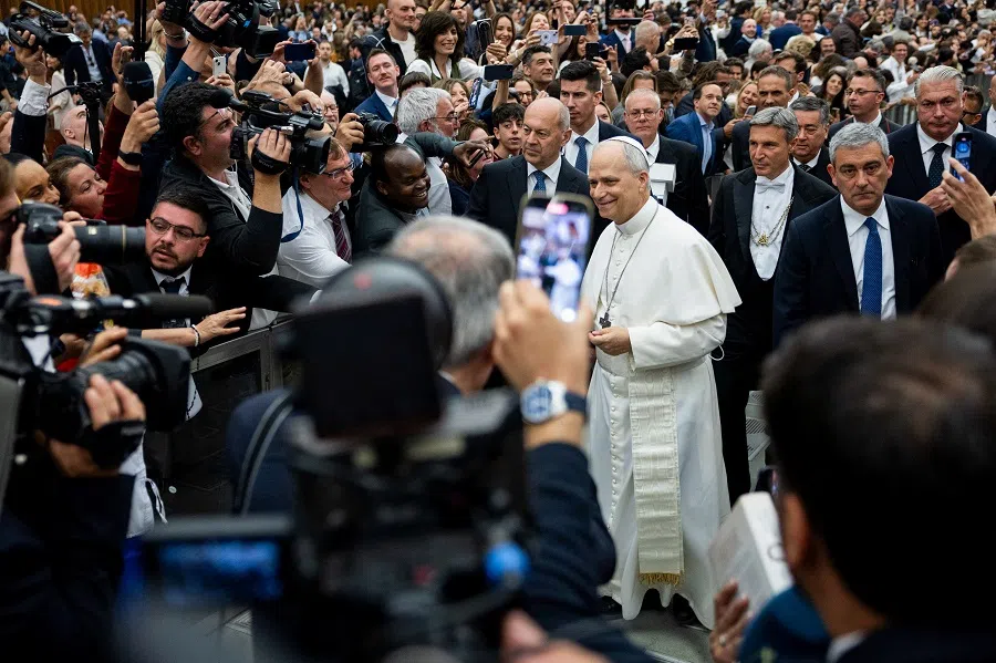 Pope Leo XIV walks on the day of an audience with representatives of the media in Paul VI hall at the Vatican, 12 May 2025.