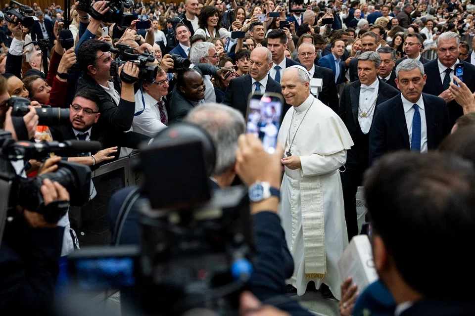 Pope Leo XIV walks on the day of an audience with representatives of the media in Paul VI hall at the Vatican, 12 May 2025. (Eloisa Lopez/Reuters)