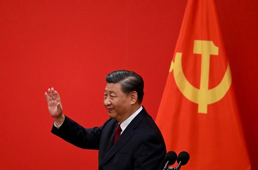 Chinese President Xi Jinping waves after introducing the members of the Chinese Communist Party's new Politburo Standing Committee, the nation's top decision-making body, in the Great Hall of the People in Beijing, China, on 23 October 2022. (Noel Celis/AFP)