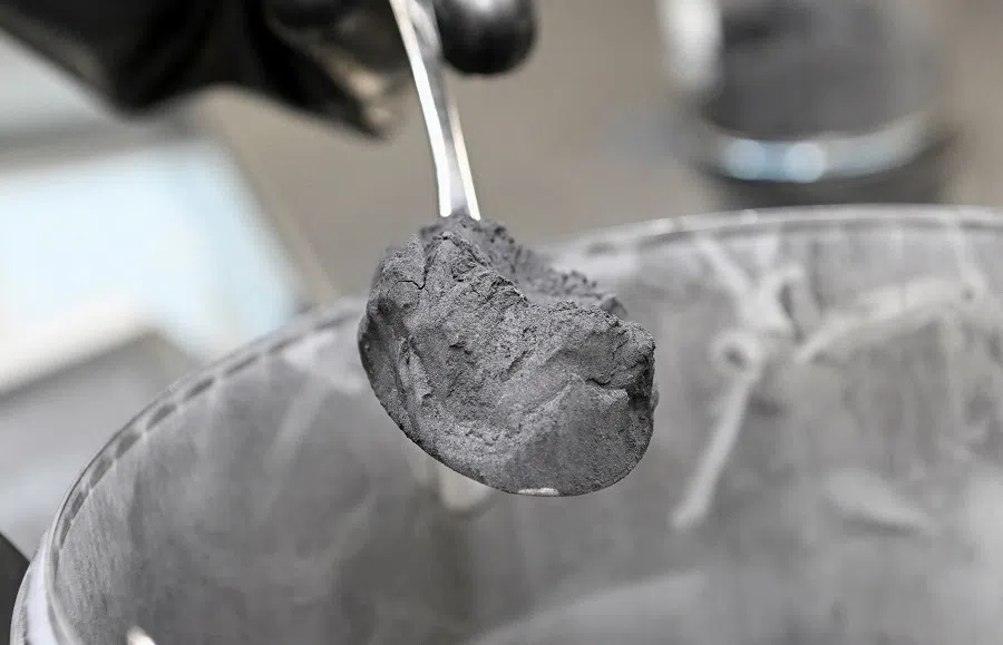 Graphite powder, used for battery paste, is pictured in a Volkswagen pilot line for battery cell production in Salzgitter, Germany, on 18 May 2022. (Fabian Bimmer/Reuters)