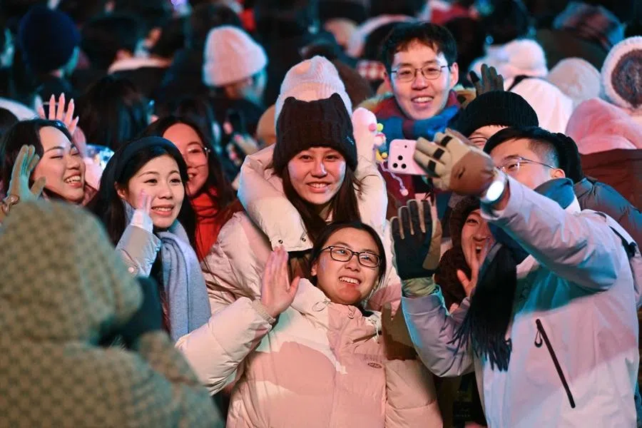 People take selfie photos as they celebrate the New Year 2026 at the Juyongguan Great Wall, Beijing, on 1 January 2026. (Adek Berry/AFP)