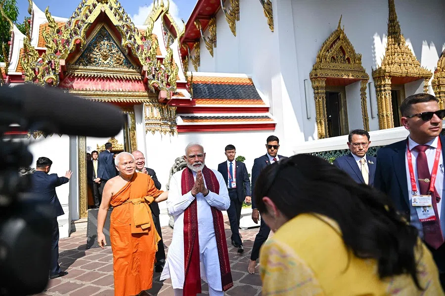 India’s Prime Minister Narendra Modi (centre) greets Thailand’s Prime Minister Paetongtarn Shinawatra at the Wat Pho Buddhist temple complex in Bangkok, Thailand on 4 April 2025, during his visit to Thailand for the 6th Bengal Initiative for Multi-Sectoral Technical and Economic Cooperation (BIMSTEC) summit. (Manan Vatsyayana/AFP)