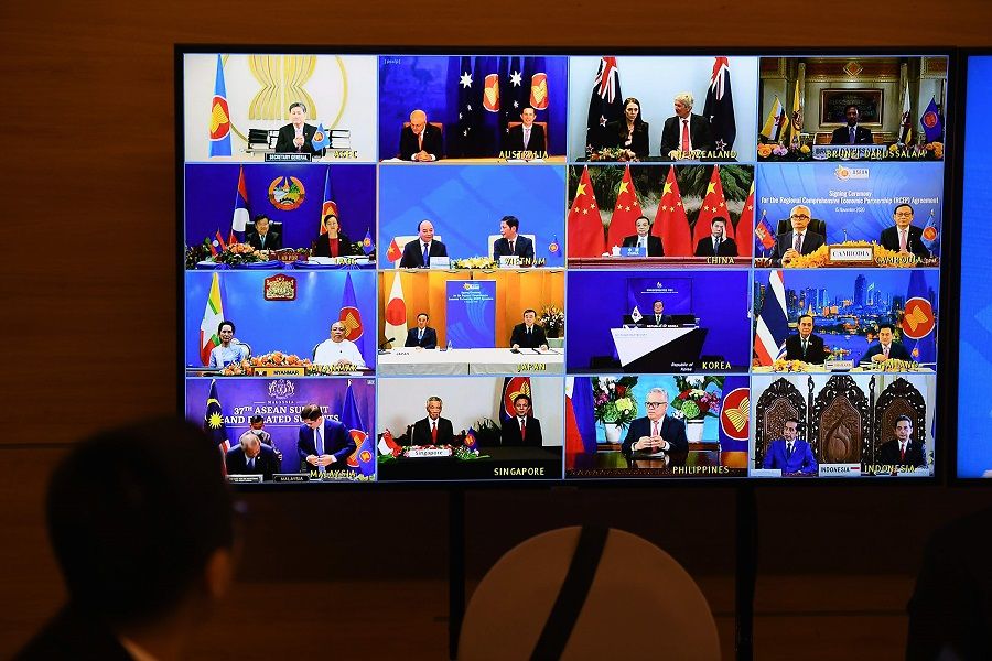 Representatives of signatory countries are pictured on screen during the signing ceremony for the Regional Comprehensive Economic Partnership (RCEP) trade pact at the ASEAN summit that is being held online in Hanoi on 15 November 2020. (Nhac Nguyen/AFP)