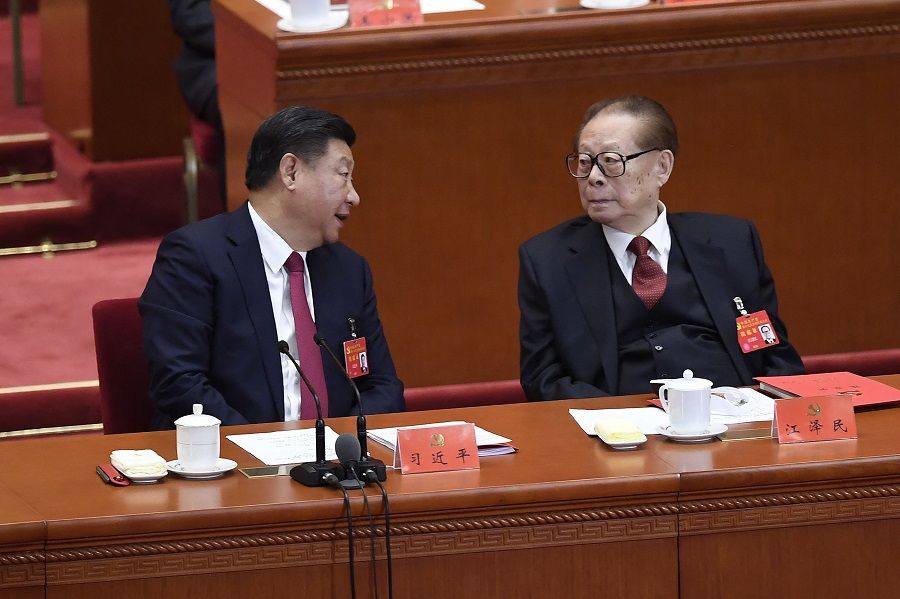 In this file photo taken on 24 October 2017, China's former president Jiang Zemin (right) listens to Chinese President Xi Jinping during the closing of the 19th Communist Party Congress at the Great Hall of the People in Beijing, China. (Wang Zhao/AFP)