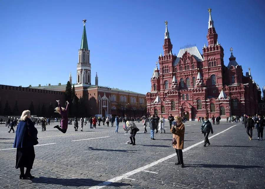People walk along the Red Square in Moscow, Russia, on 20 March 2022. (Stringer/AFP)