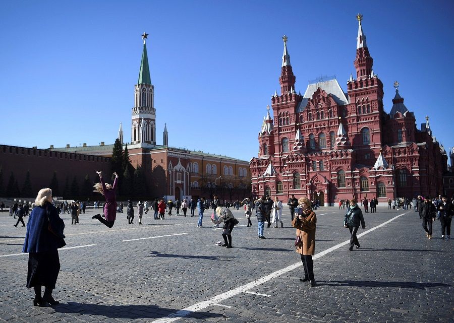 People walk along the Red Square in Moscow, Russia, on 20 March 2022. (Stringer/AFP)