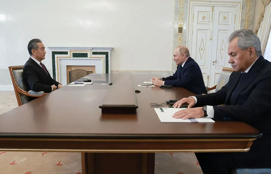 In this pool photograph distributed by the Russian state agency Sputnik, Russia’s President Vladimir Putin, accompanied by the country’s Security Council Secretary Sergei Shoigu, meets with Chinese Foreign Minister Wang Yi in Saint Petersburg on 12 September 2024. (Vyacheslav Prokofyev/AFP)