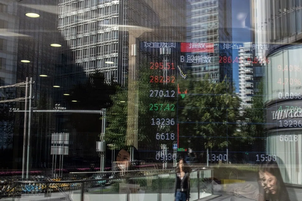 A screen displays stock figures in Beijing, China, on 8 October 2024. (Gilles Sabrie/Bloomberg)