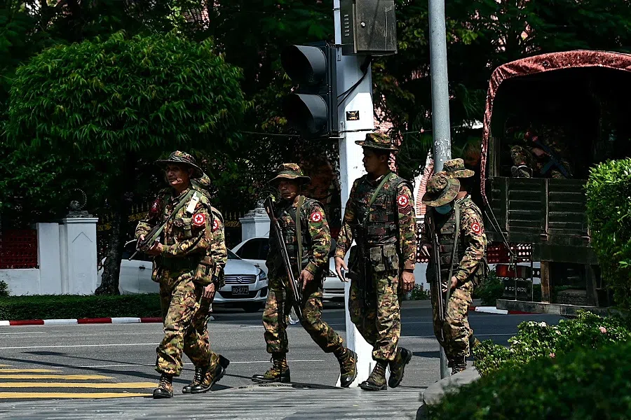 Members of Myanmar's military security force patrol a street during a "silent strike" to protest and to mark the third anniversary of the military coup in Yangon on 1 February 2024. (AFP)