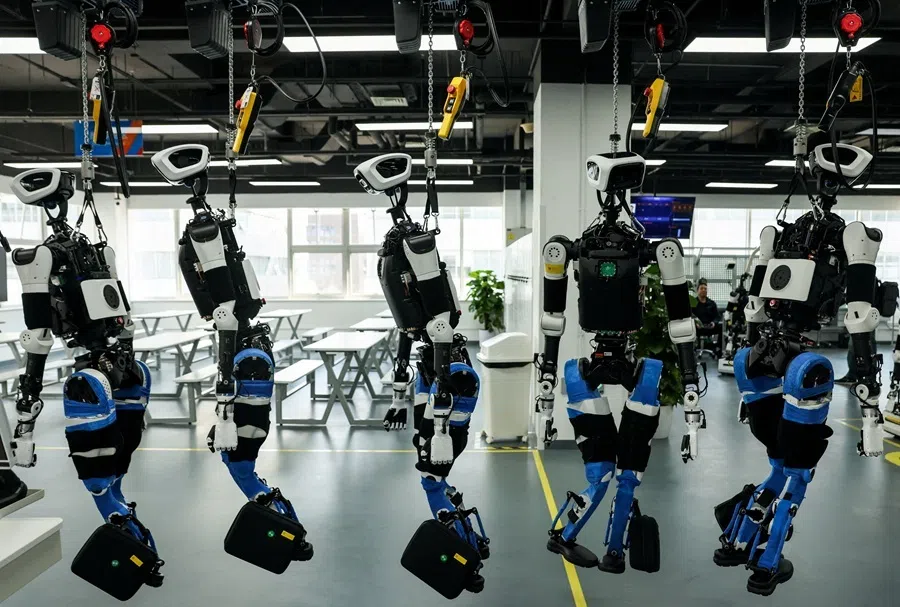 Humanoid robots at the production line during an organised media tour to the Robotics Pilot Testing and Validation Platform of Beijing Innovation Center of Humanoid Robotics (X-Humanoid) in Beijing, China, 20 March 2026.