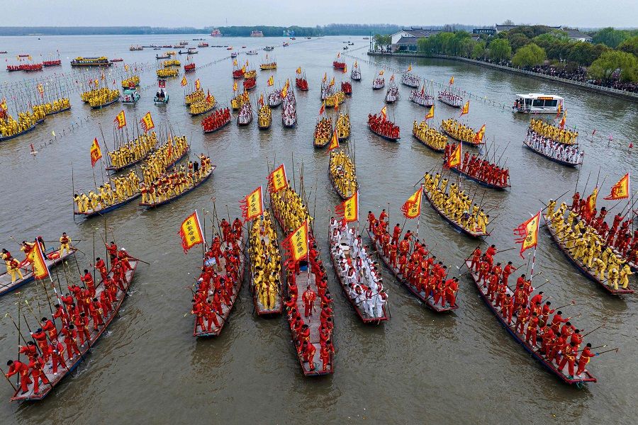 An aerial view shows participants on their traditional boats during the Taizhou Jiangyan Qintong Boat Festival at the Qinhu National Wetland Park in Taizhou, in eastern China's Jiangsu province on 6 April 2024. (AFP)