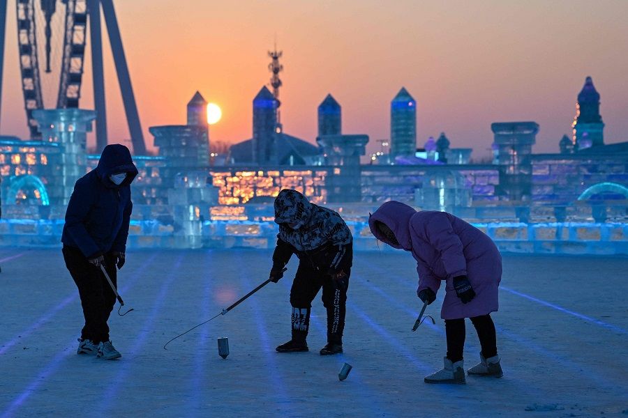 Children play at the Harbin Ice and Snow World in Harbin, Heilongjiang province, China, on 5 January 2023. (Hector Retamal/AFP)