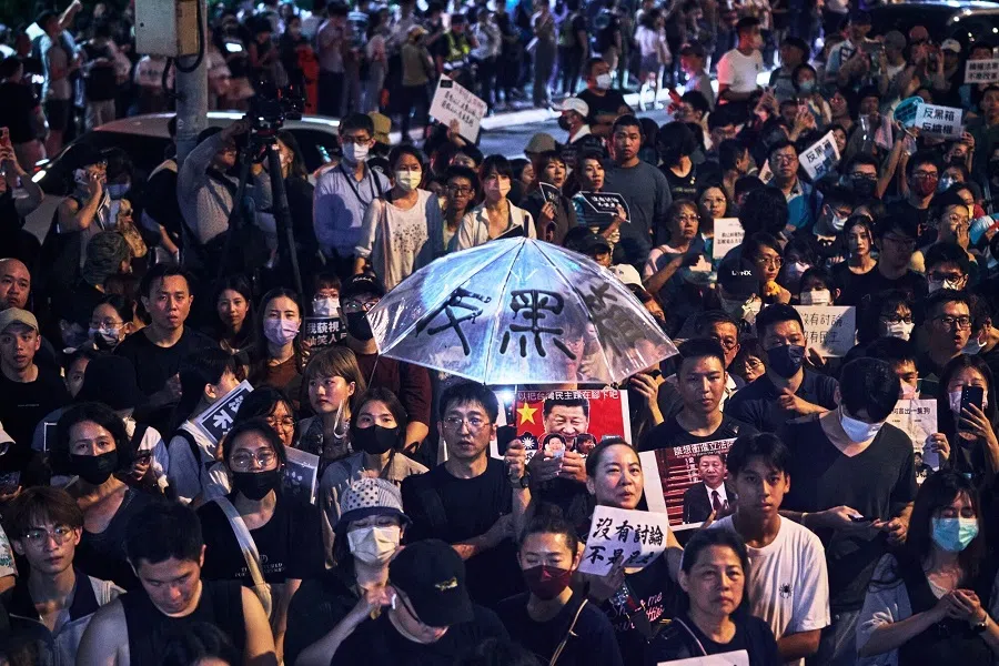 Demonstrators gather during a protest outside the Legislative Yuan in Taipei, Taiwan, on 24 May 2024. Protesters took to the streets in Taiwan as opposition lawmakers proceeded with a bill intended to curtail the powers of the new president, Lai Ching-te.  (An Rong Xu/Bloomberg)