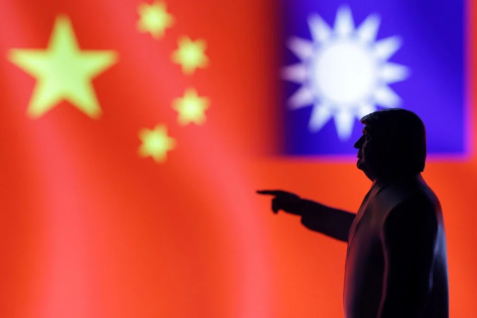 A 3D-printed miniature model depicting US President Donald Trump, the Chinese flag and a fragment of the Taiwanese flag in this illustration taken on 17 April 2025. (Dado Ruvic/Reuters)