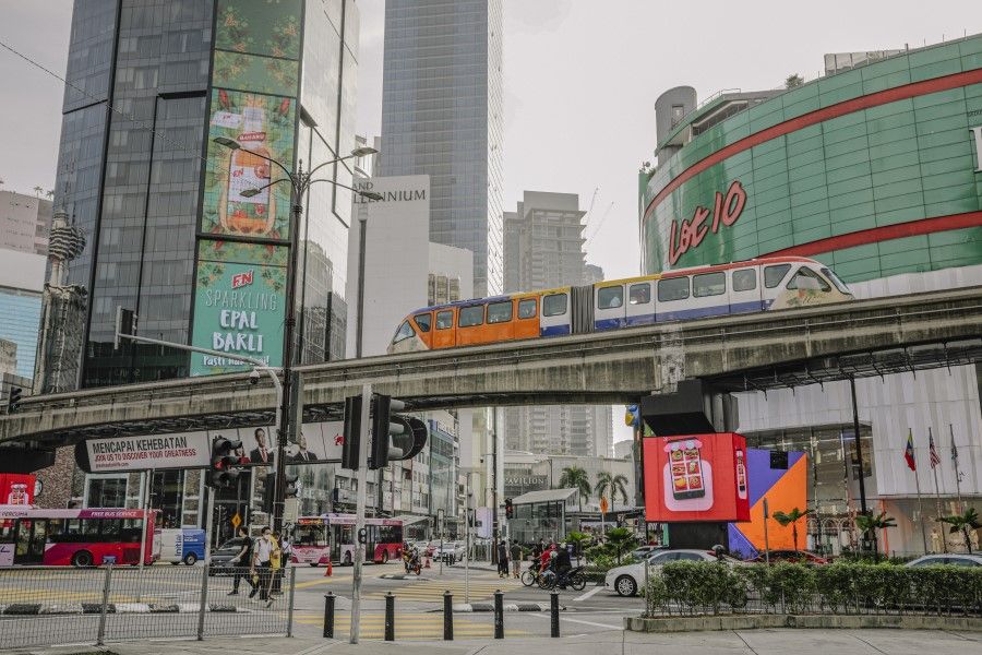 A monorail train travels on an elevated track through central Kuala Lumpur, Malaysia, on 5 April 2021. (Ian Teh/Bloomberg)