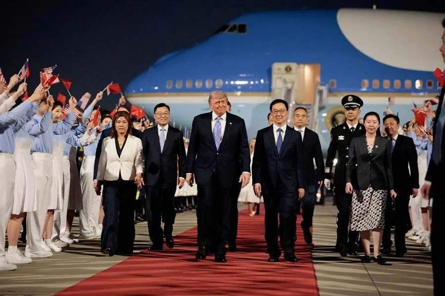 US President Donald Trump walks with Chinese Vice-President Han Zheng during an arrival ceremony at Beijing Capital International Airport, in Beijing, China, 13 May 2026. (Evan Vucci/Reuters)