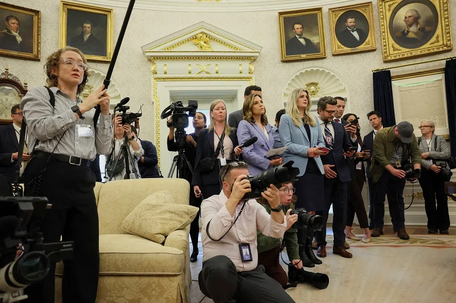 Members of the media work during a swearing-in ceremony for the new US ambassador to China, former US Senator David Perdue, held by US President Donald Trump at the White House in Washington, DC, US, on 7 May 2025. (Leah Millis/Reuters)