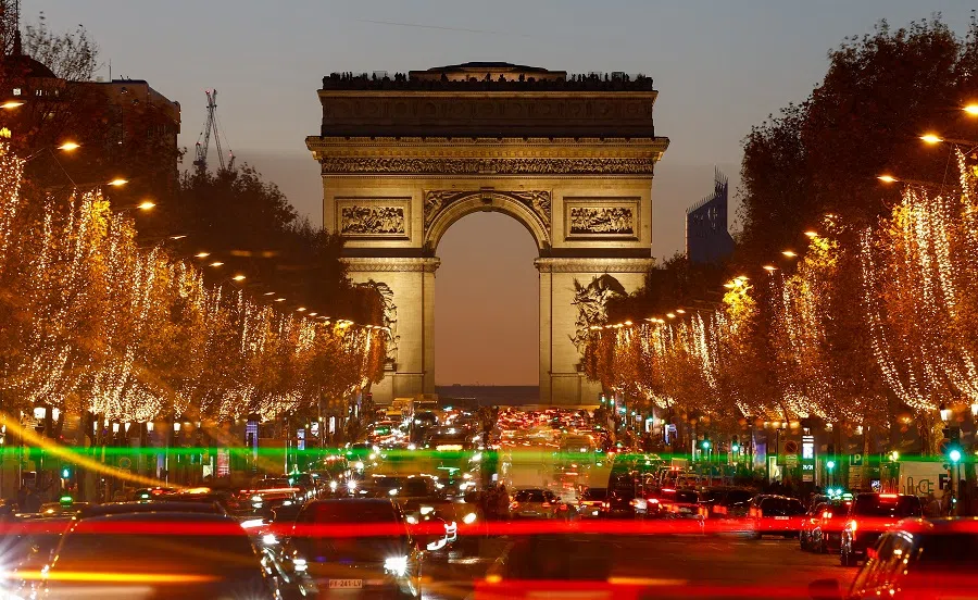 A general view shows the Champs-Elysees avenue with the annual Christmas holiday lights, with the Arc de Triomphe in the background, in Paris, France, on 29 November 2024. (Christian Hartmann/Reuters)