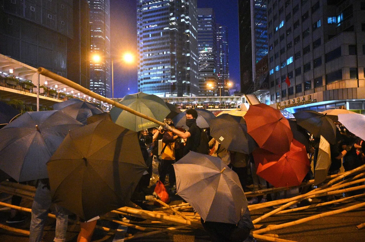 Do these people still believe at the present point that escalating the militant movement will bring about a desirable outcome? (Philip Fong / AFP)