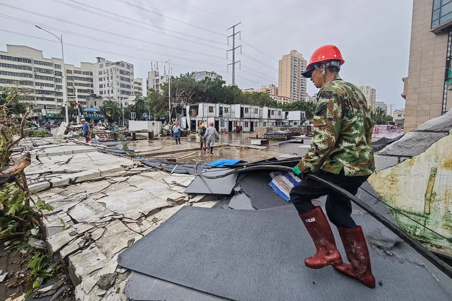A worker walks past a damaged area caused by Super Typhoon Yagi in Haikou, in southern China’s Hainan province on 7 September 2024. (CNS/AFP)