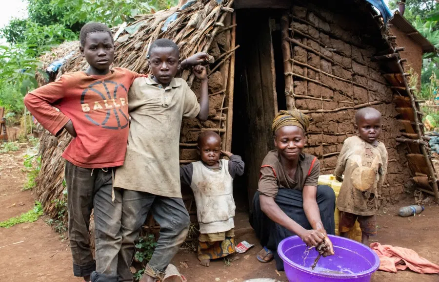 A woman washes her laundry outside a shelter after a consultation meeting with the indigenous peoples of the Muyange village in Tshivanga near the Kahuzi-Biega National Park, in the South Kivu Province of the Democratic Republic of the Congo, 16 June 2023. (Crispin Kyalangalilwa/Reuters)