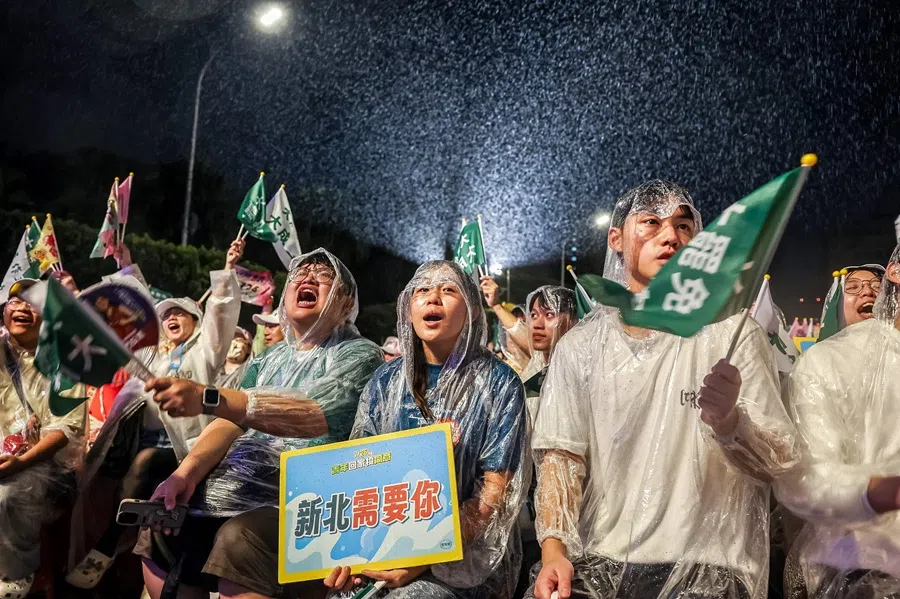 Supporters participate in a pro-recall rally in front of the presidential hall amid heavy rain in Taipei on 24 July 2025. (I-Hwa Cheng/AFP)