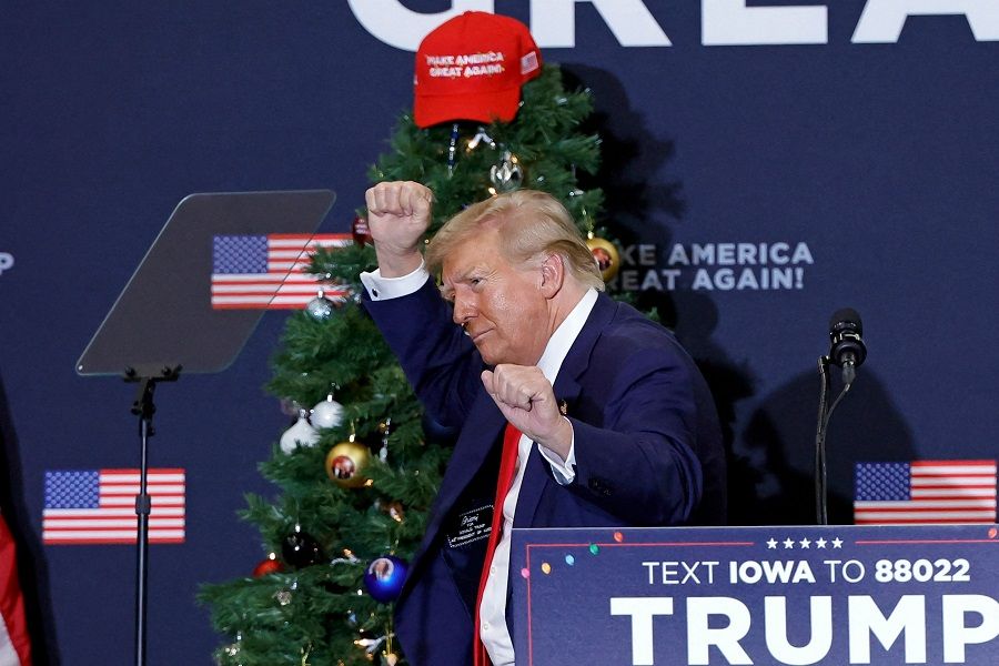 Former US President and 2024 presidential hopeful Donald Trump gestures during a campaign event in Waterloo, Iowa, US, on 19 December 2023. (Kamil Krzaczynski/AFP)