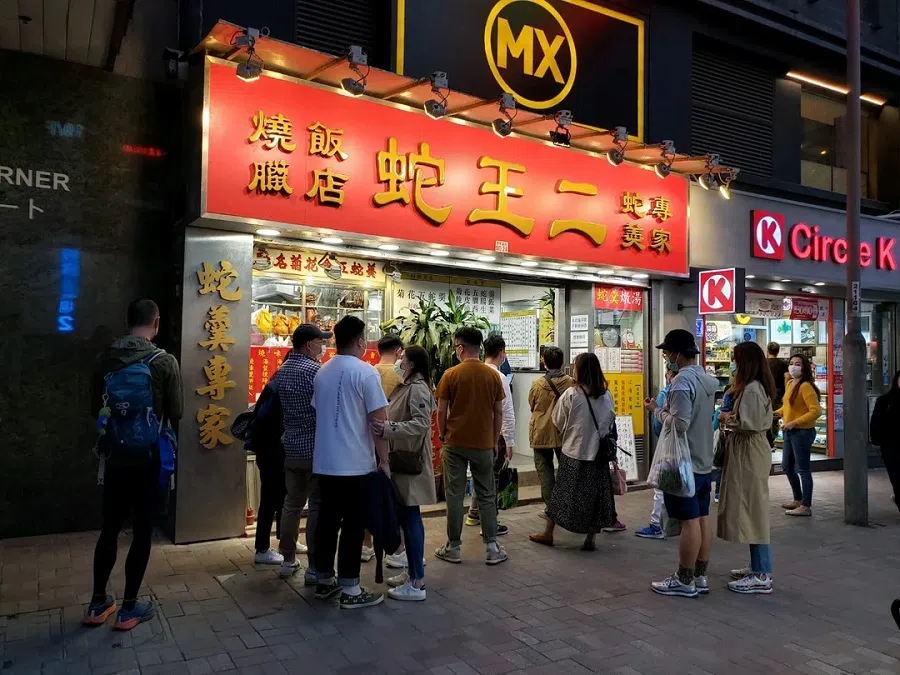 People wait outside a store specialising in snake soup in Causeway Bay, Hong Kong. (OpenRice.com website)