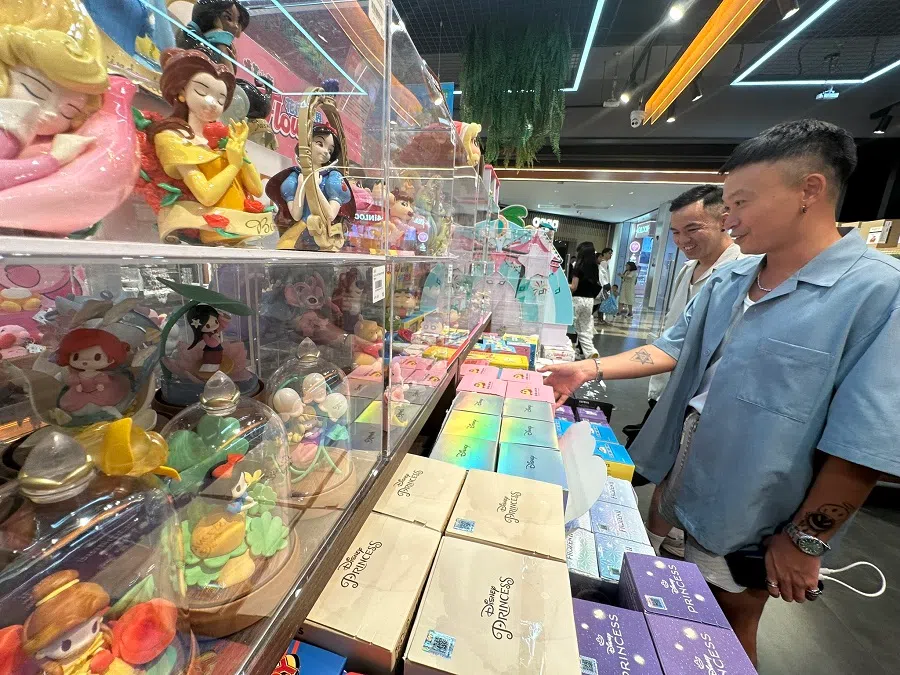 People pick out blind boxes containing trendy collectible toys.