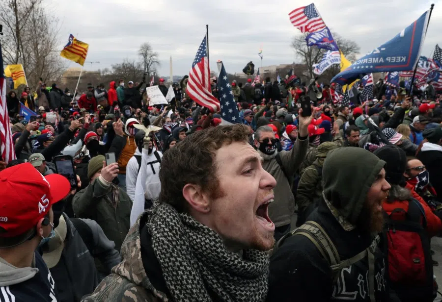 A mob of supporters of US President Donald Trump storm the US Capitol Building in Washington, US, 6 January 2021. (Leah Millis/REUTERS)