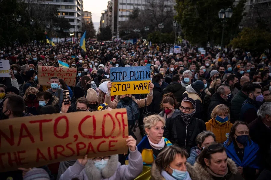 Ukrainians and supporters protest during a demonstration against the Russian invasion of Ukraine in front of the Greek Parliament in Athens, Greece, on 1 March 2022. (Angelos Tzortzinis/AFP)