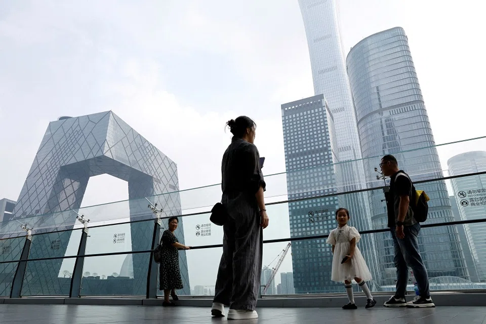 People at a shopping mall in Beijing's central business district, China, on 7 September 2023. (Tingshu Wang/Reuters)