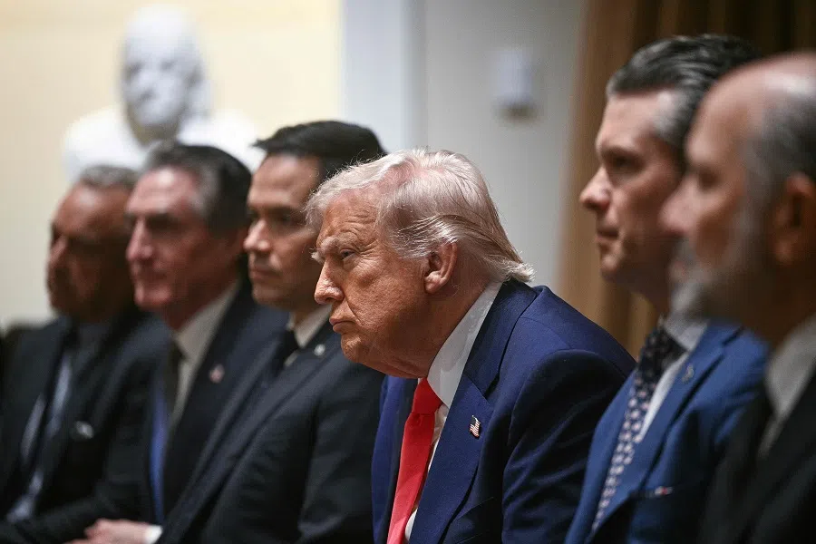 US President Donald Trump (centre) looks on during a cabinet meeting in the Cabinet Room of the White House on 10 April 2025, in Washington, DC.
