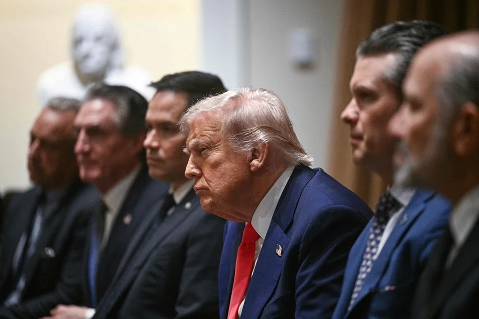 US President Donald Trump (centre) looks on during a cabinet meeting in the Cabinet Room of the White House on 10 April 2025, in Washington, DC. (Brendan Smialowski/AFP)