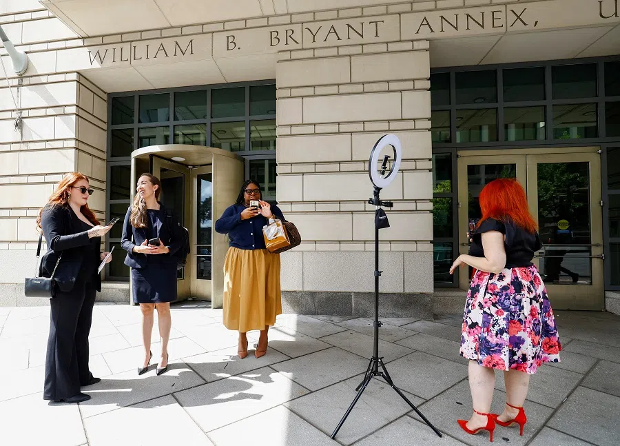 TikTok journalist Tiffany Ciancia and TikTok creators Talia Cadet and Kiera Spann stand after a US Court of Appeals hearing, where TikTok and parent company ByteDance are seeking to block a law that could ban the app used by 170 million Americans, at US District Court in Washington, US, on 16 September 2024. (Piroschka van de Wouw/Reuters)