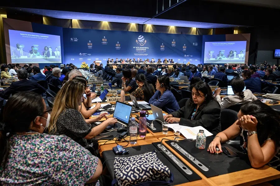 Delegates attend the closing session of a World Trade Organization Ministerial Conference at the WTO headquarters in Geneva, Switzerland, on 17 June 2022. (Fabrice Coffrini/Pool/AFP)