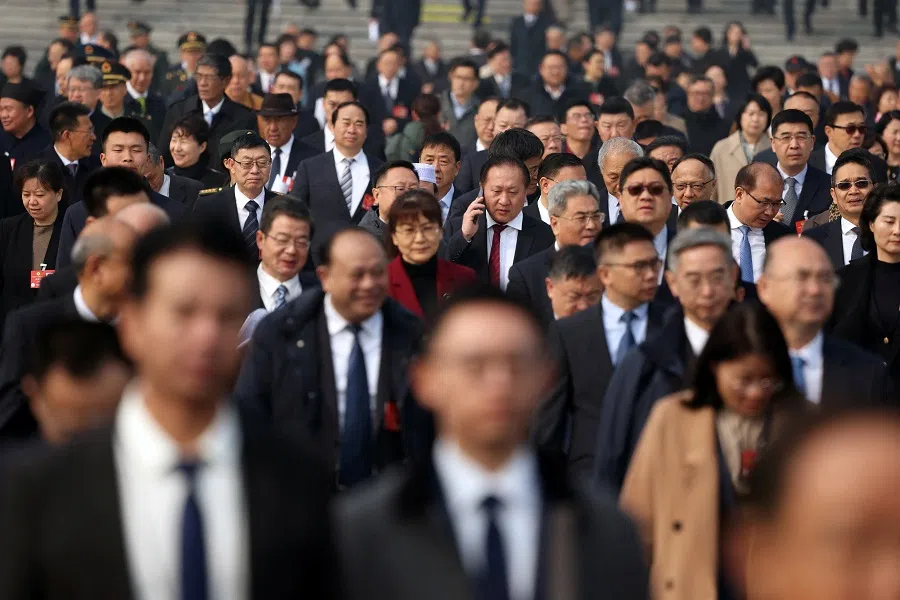 Delegates leave the Great Hall of the People following the third plenary session of the Chinese People’s Political Consultative Conference (CPPCC) in Beijing, China, on 9 March 2025. (Florence Lo/Reuters)