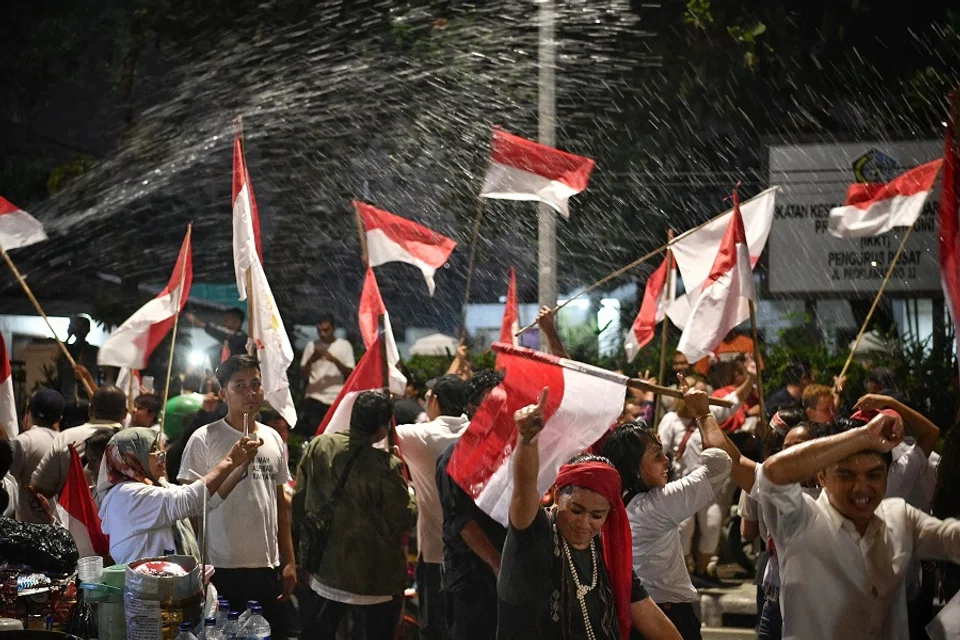 Supporters gathered outside one of the main campaign centres in Jakarta, Indonesia, celebrating Jokowi's victory by sample votes in 2019. (SPH Media)