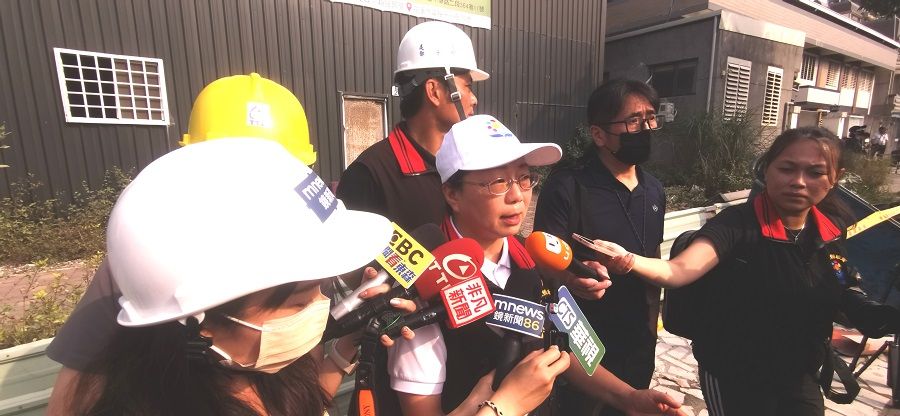 Hualien county magistrate Hsu Chen-wei speaks to the media at the site of the severely damaged Beibin Street building on 4 April 2024.
