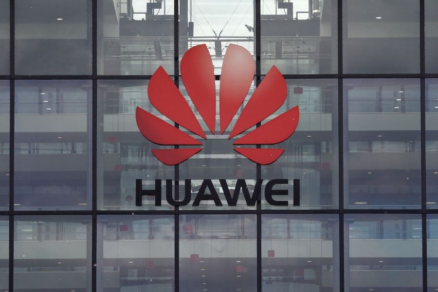 Huawei is a major player and among the leaders in the 5G competition, but critics point out that its chips are made with US technology. (Adrian Dennis/AFP)