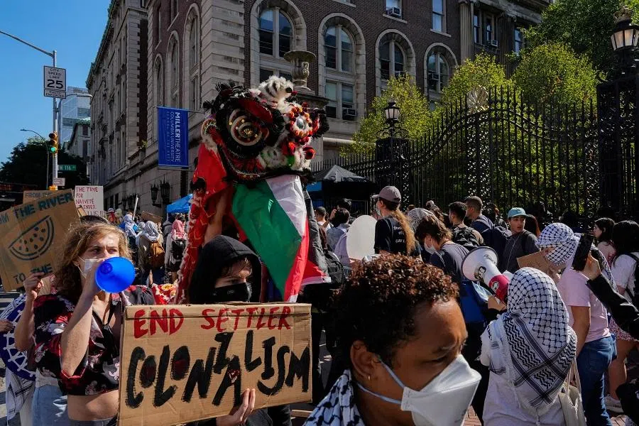 Pro-Palestinian supporters protest outside Columbia University as people arrive for the first day of the new semester, in New York City, US, on 3 September 2024. (Adam Gray/Reuters)