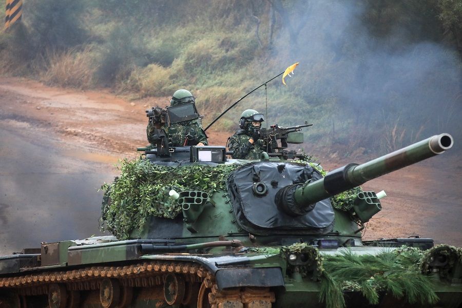 Taiwan Armed Forces soldiers crew a CM-11 Brave Tiger main battle tank during a military combat live-fire exercise in Hsinchu, Taiwan, on 21 December 2021. (I-Hwa Cheng/Bloomberg)