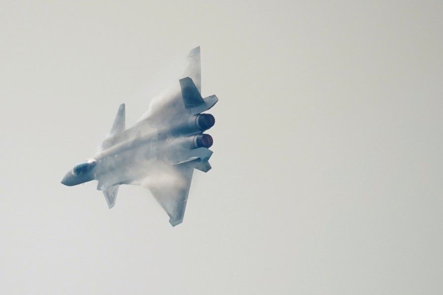 A J-20 stealth fighter jet of the Chinese People's Liberation Army (PLA) Air Force performs at Airshow China, in Zhuhai, Guangdong province, China, 28 September 2021. (Aly Song/Reuters)