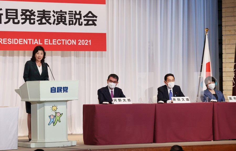Seiko Noda delivers her campaign speech for the Liberal Democratic Party (LDP)'s presidential election as other candidates (from left) Taro Kono, Fumio Kishida, and Sanae Takaichi listen at the party's headquarters in Tokyo, Japan, on 17 September 2021. (Yoshikazu Tsuno/Bloomberg)