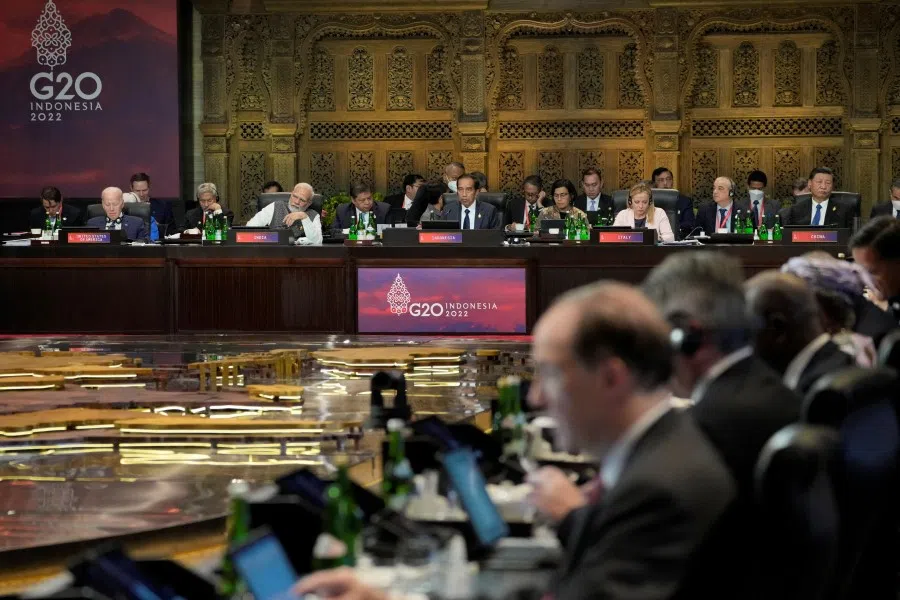 Indian Prime Minister Narendra Modi (front row, second from left) and Chinese President Xi Jinping (front row, first from right) listen as Indonesia President Joko Widodo speaks during the G20 leaders summit in Nusa Dua, Bali, 1 November 2022. (Dita Alangkara/Pool via Reuters)